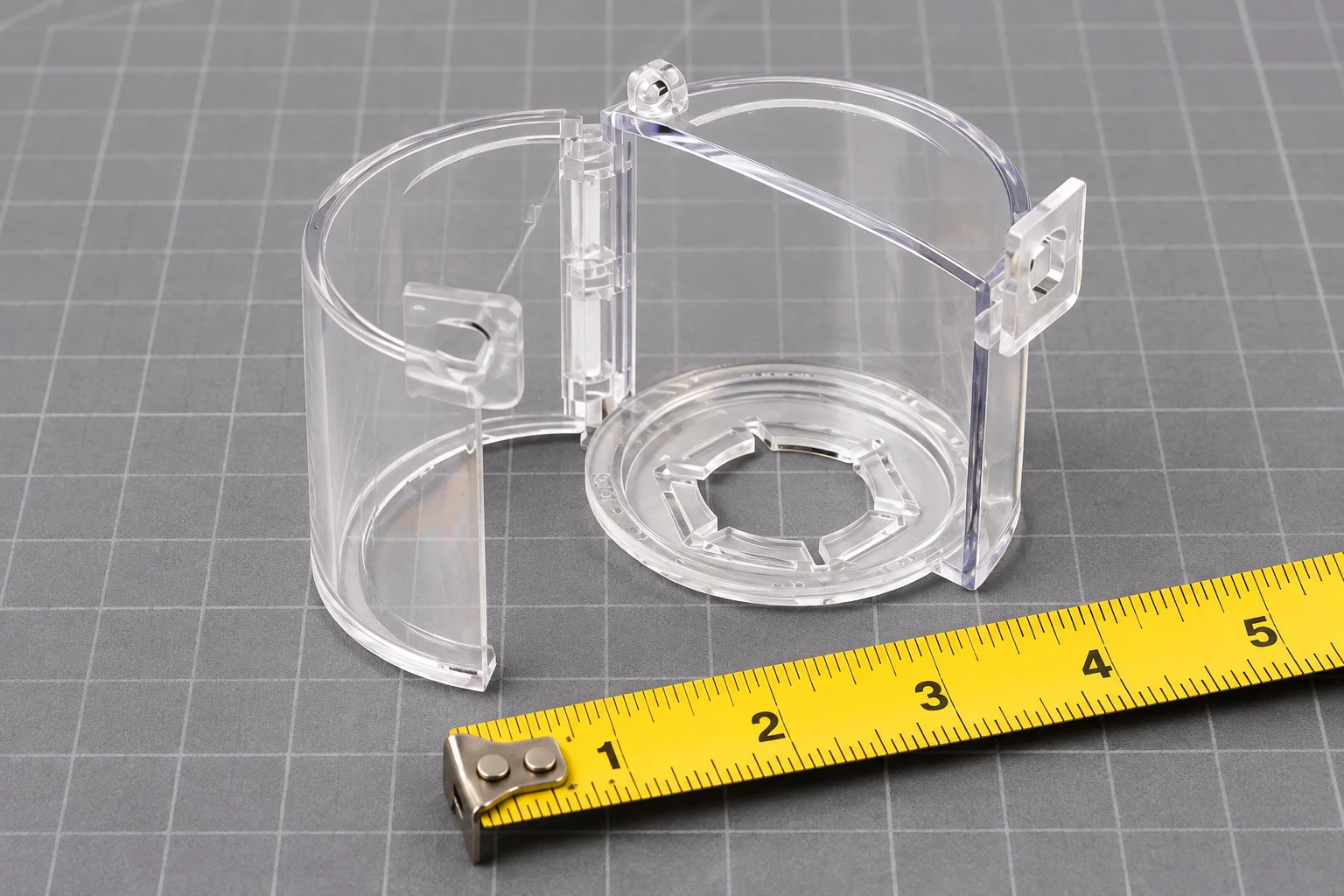 Transparent cylindrical control cover beside a measuring tape